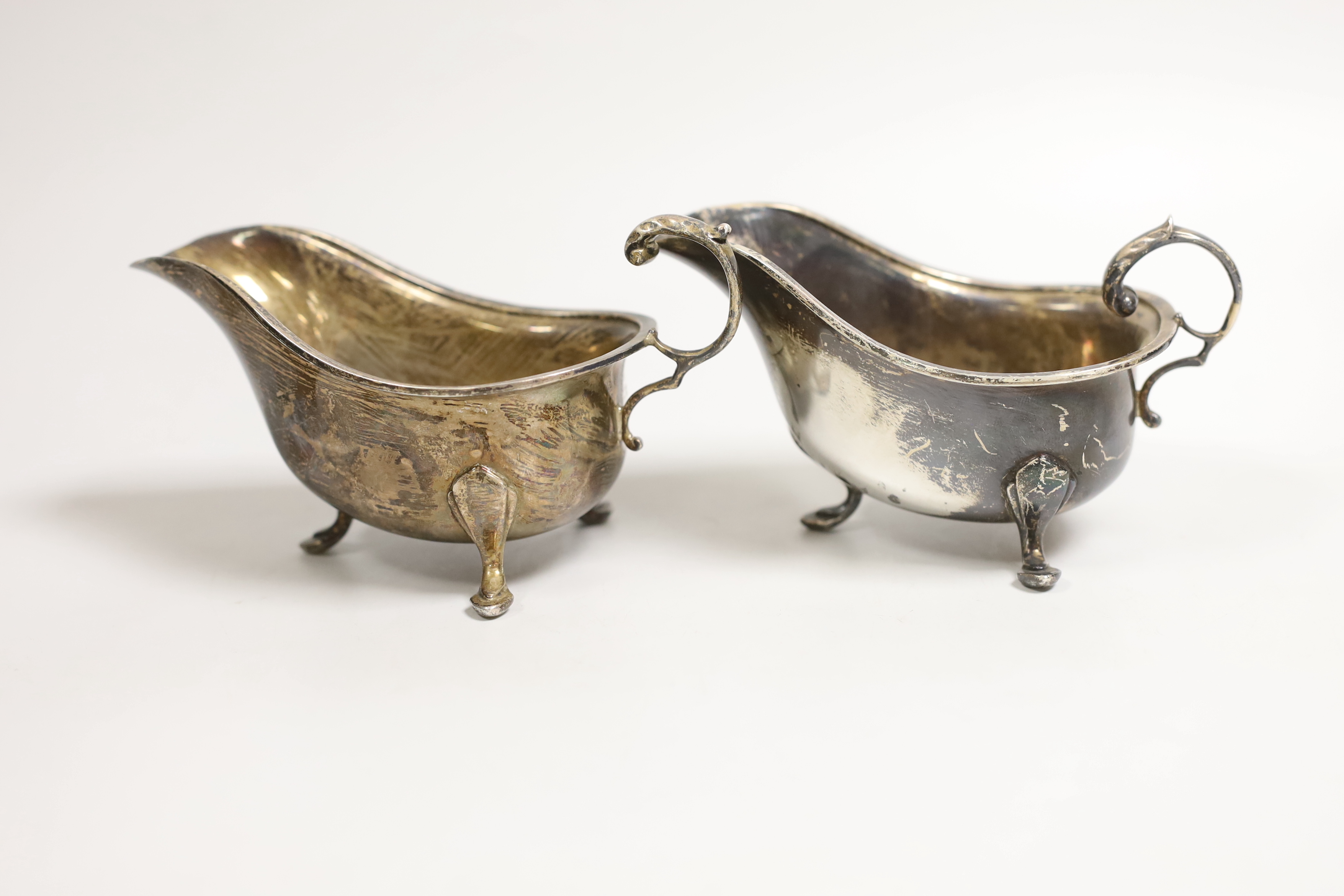 A pair of George VI silver sauce boats